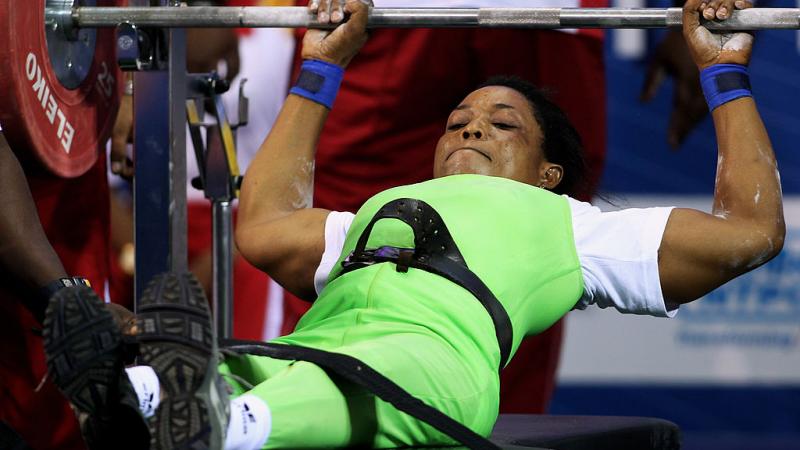 a female powerlifter prepares to lift