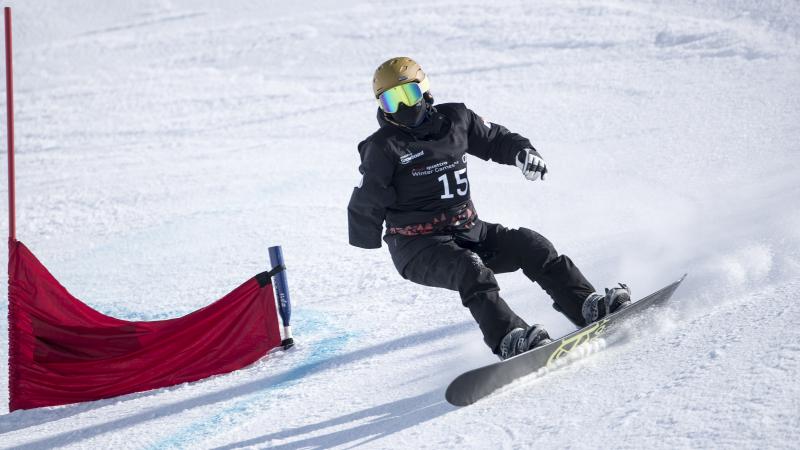 a Para snowboarder goes down a slope