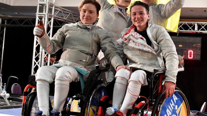 Ukraine's women celebrate the defence of their sabre team world title in Rome, Italy.