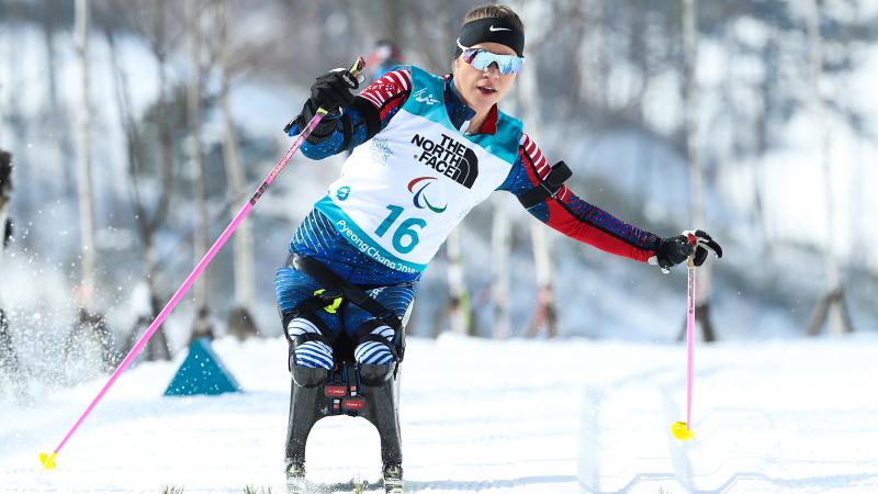 a female sit skier in action