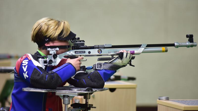 a female Para shooter taking a shot