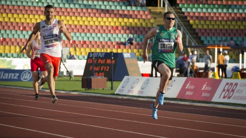 male vision impaired sprinter Jason Smyth runs towards the finish line