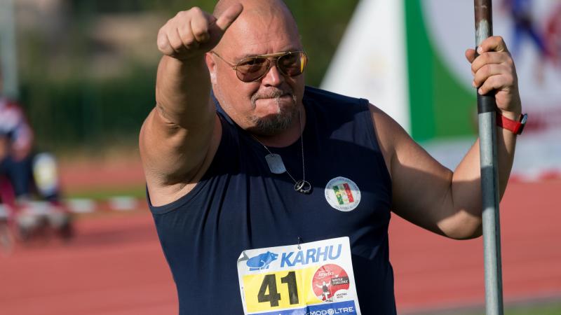 Giuseppe Campoccio holding the javelin