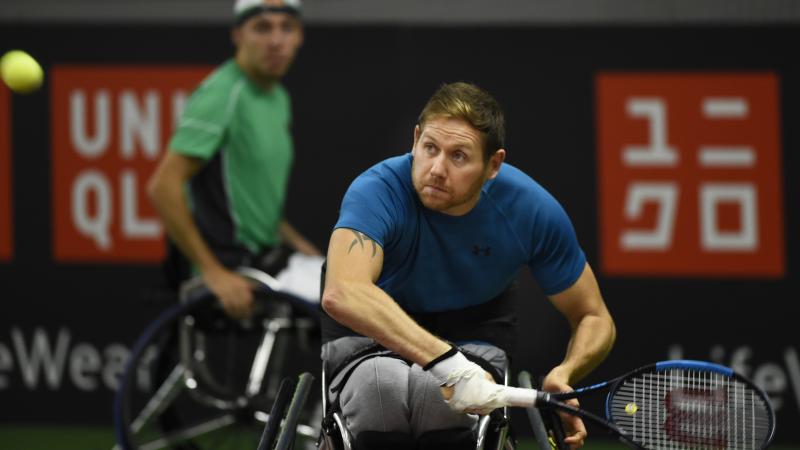 male wheelchair tennis players Antony Cotterill and Andy Lapthorne in action on the court