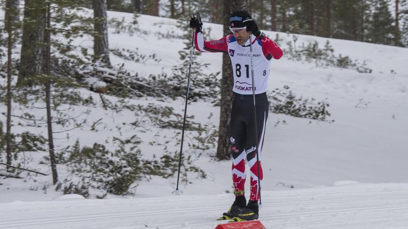 male Para Nordic skier Brian McKeever stands on skis