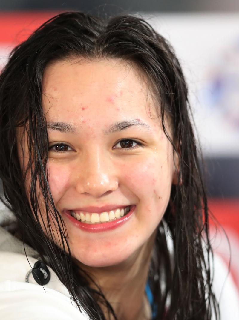 a female Para swimmer smiling