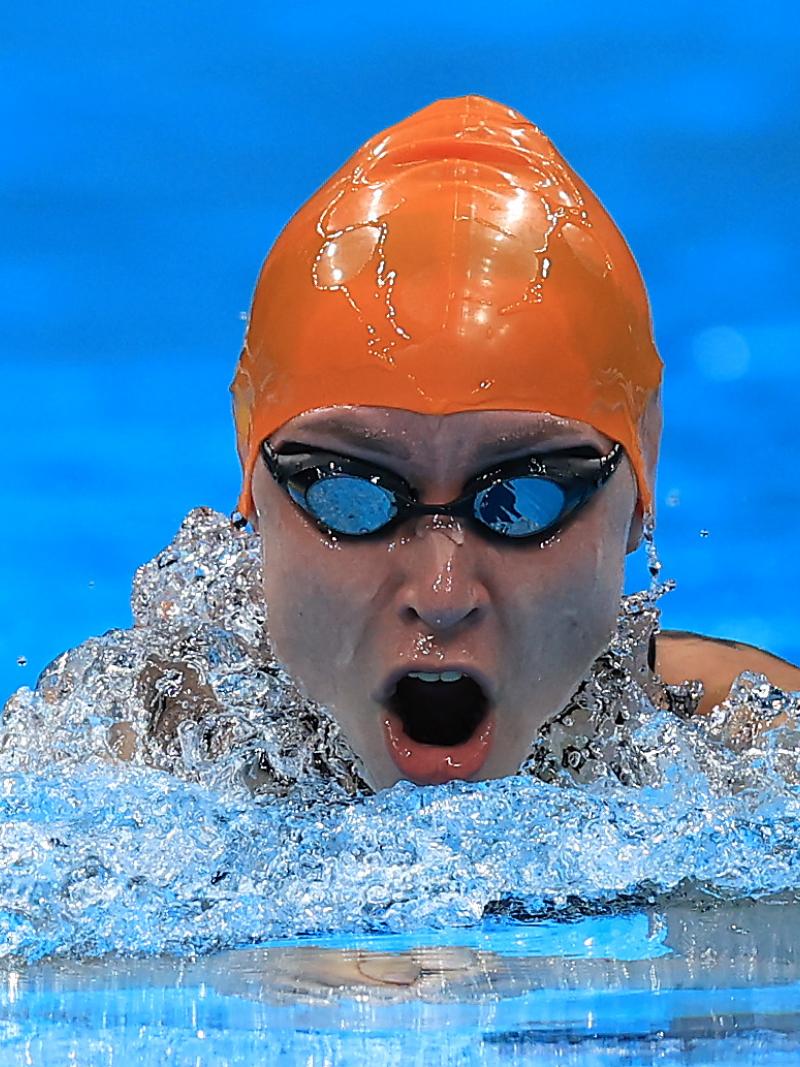 A woman swimming breaststroke