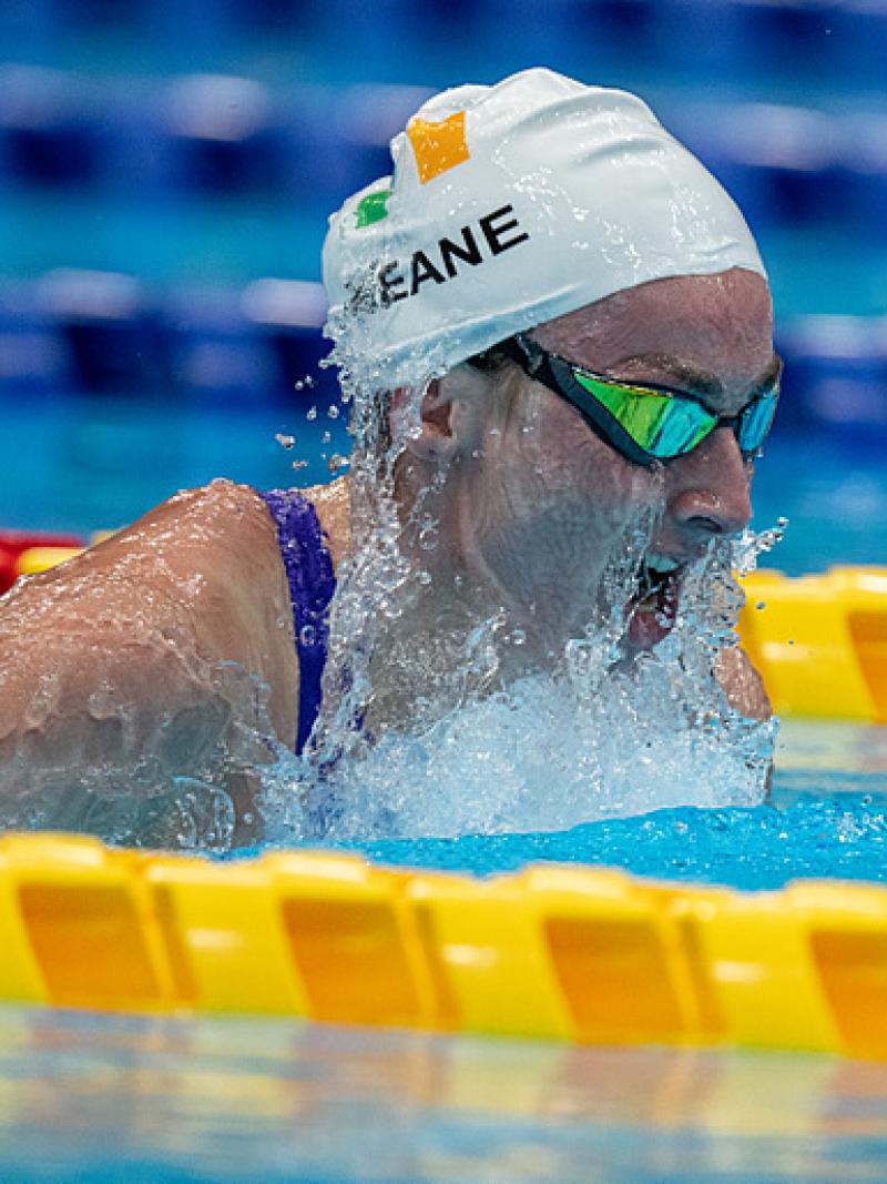 A female swimmer swimming breaststroke