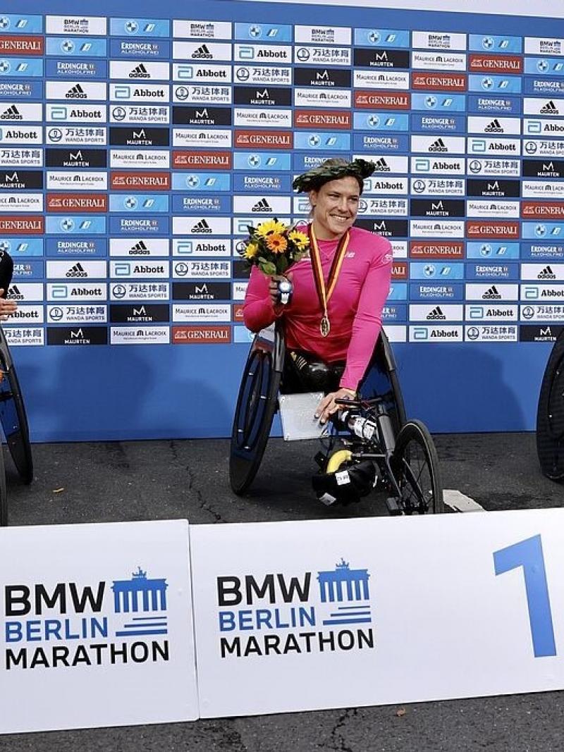 Three female wheelchair racers in the podium of the Berlin Marathon