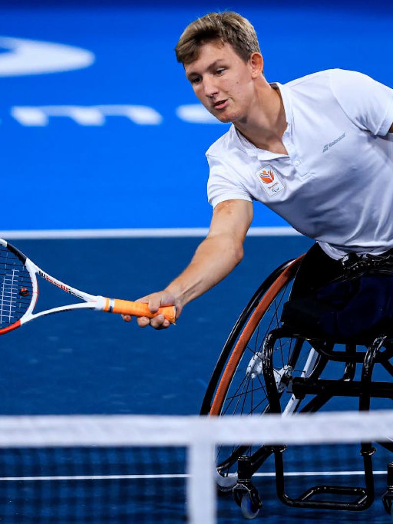 A male wheelchair tennis player in action at the Tokyo 2020 Paralympics