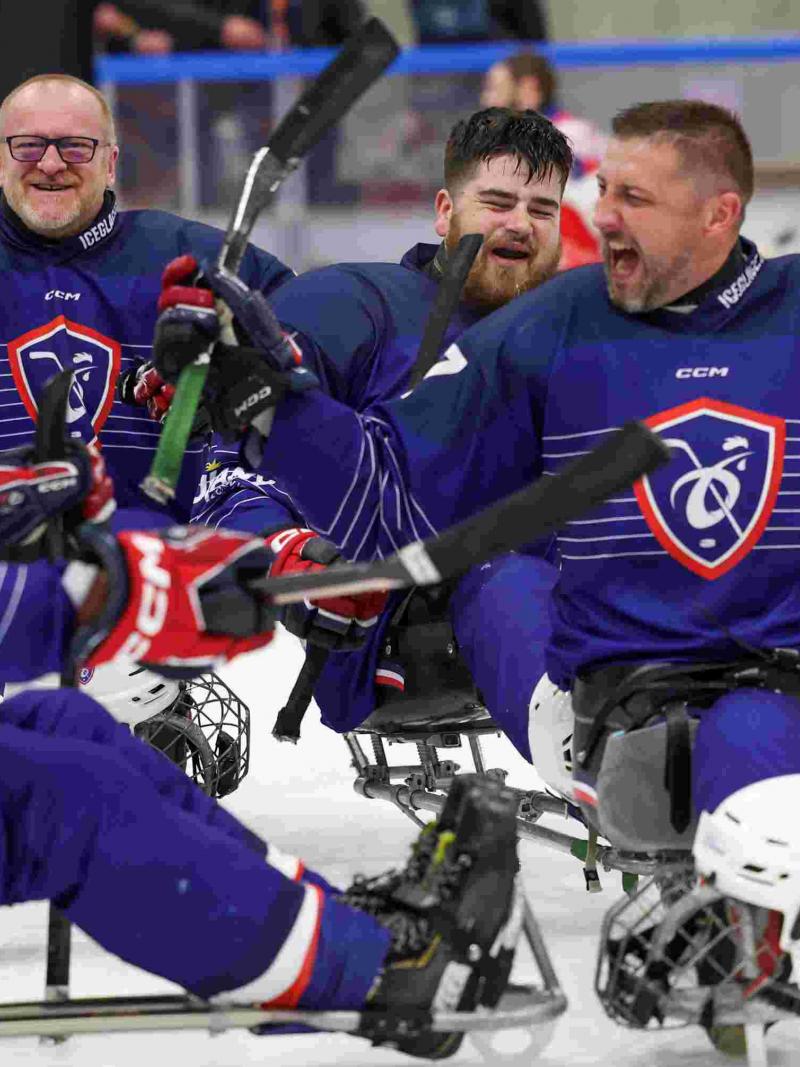 Para ice hockey players celebrate