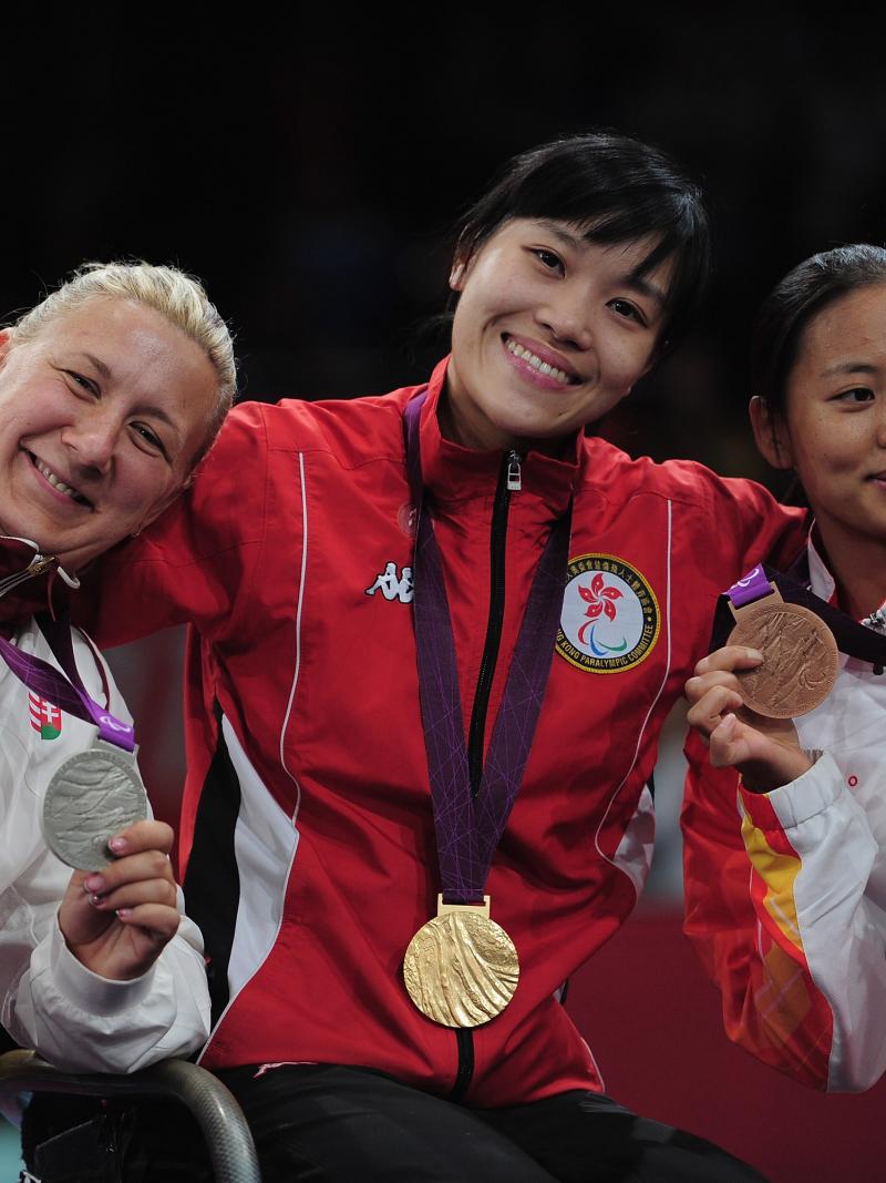 A picture of three women showing their medals