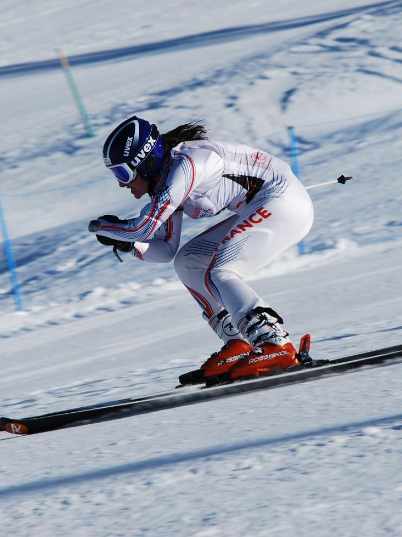 A picture of a woman skiing.