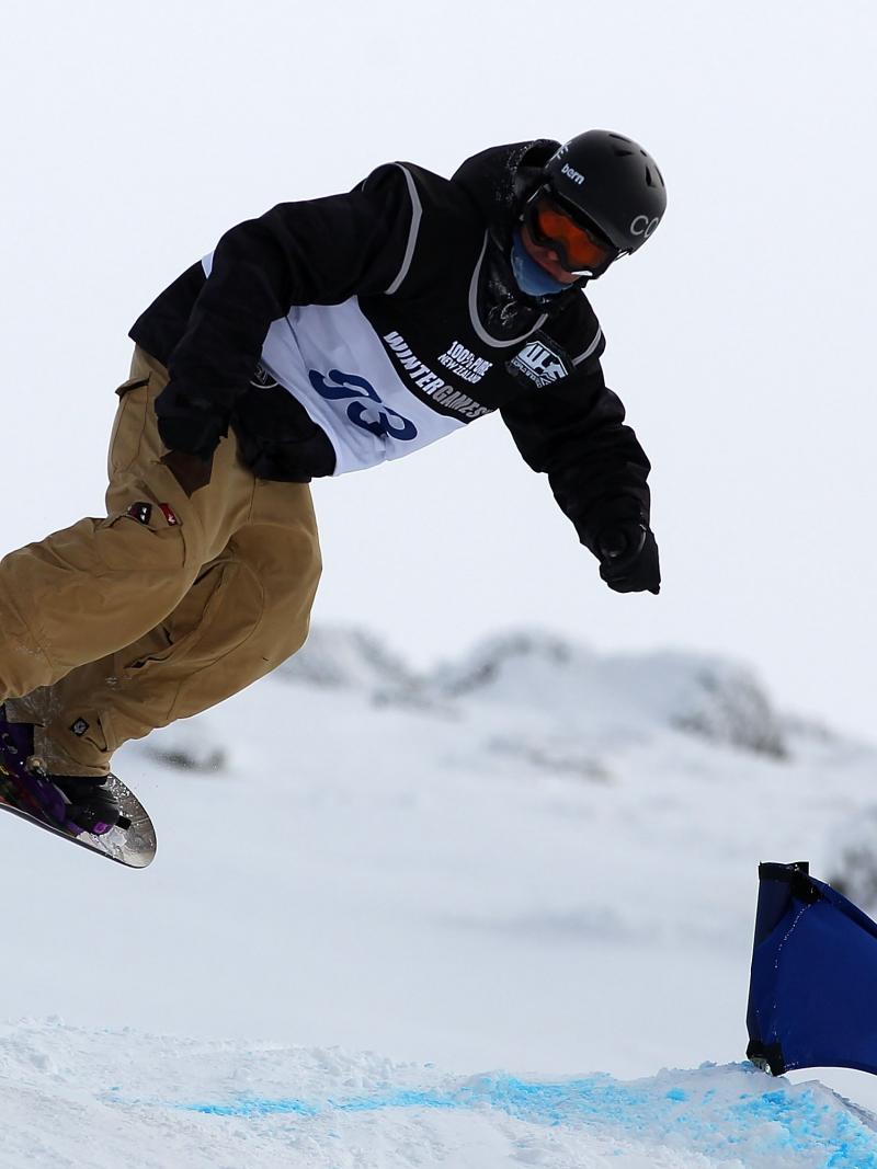 A picture of a man practising snowboard