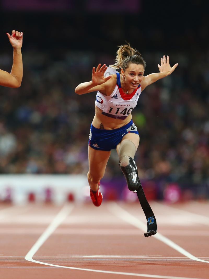 A picture of three women running on the track