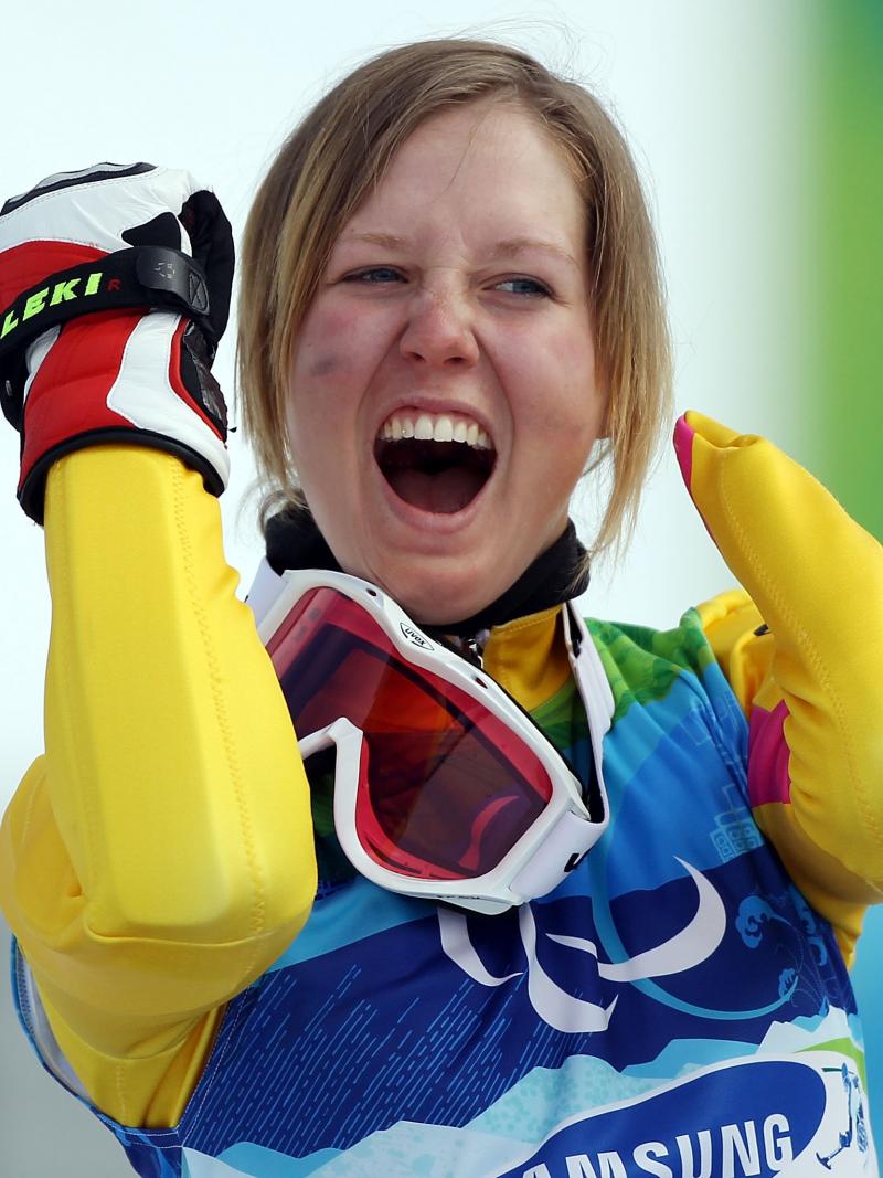 A picture of a woman celebrating her victory