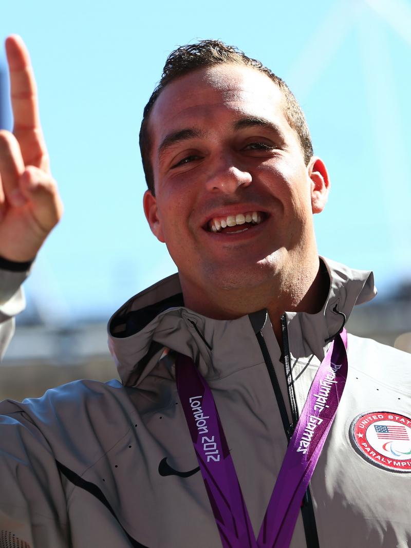 A picture of a man with a medal around his neck