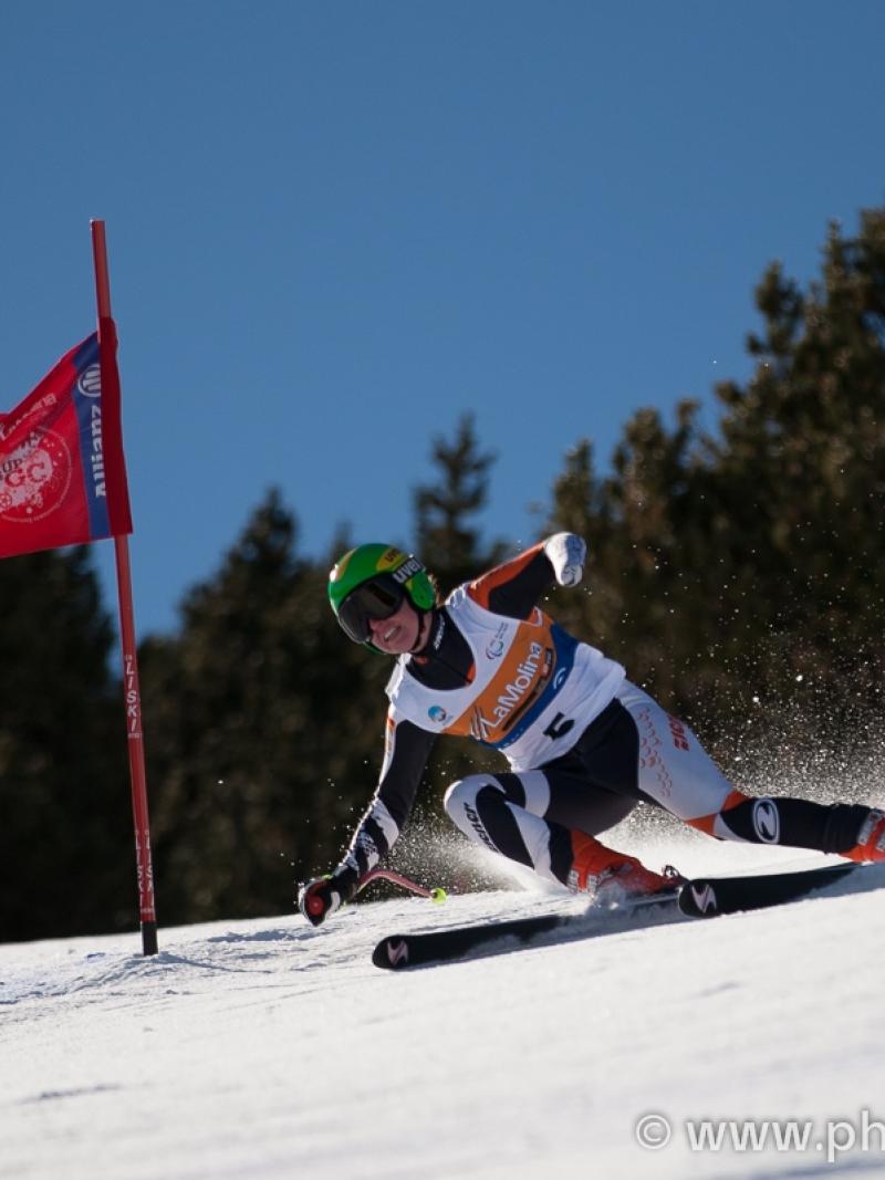 A picture of a woman skiing on the slopes