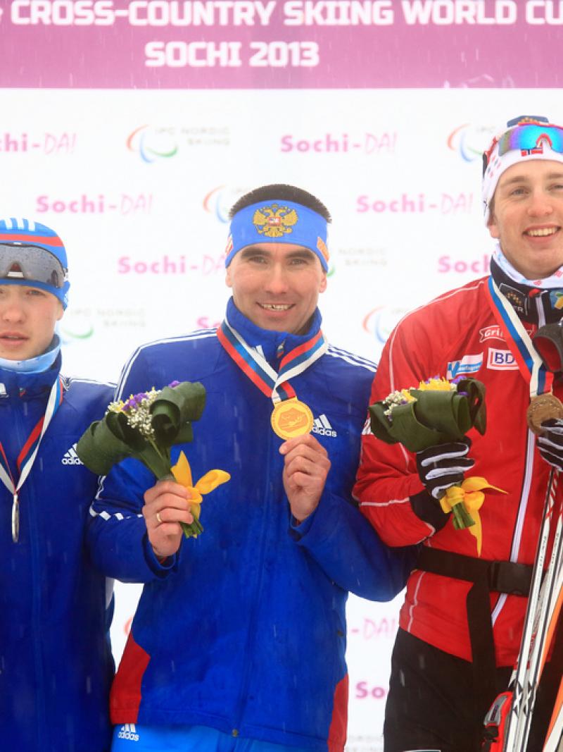 standing men on podium for cross country sprint