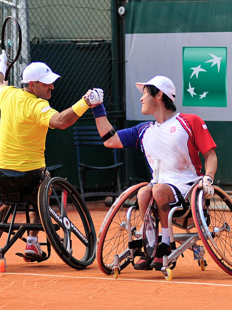 France's Stephane Houdet, left, defeated Shingo Kunieda for the 2013 Roland Garros men's singles titles, and just hours later partnered with him to win the doubles title.