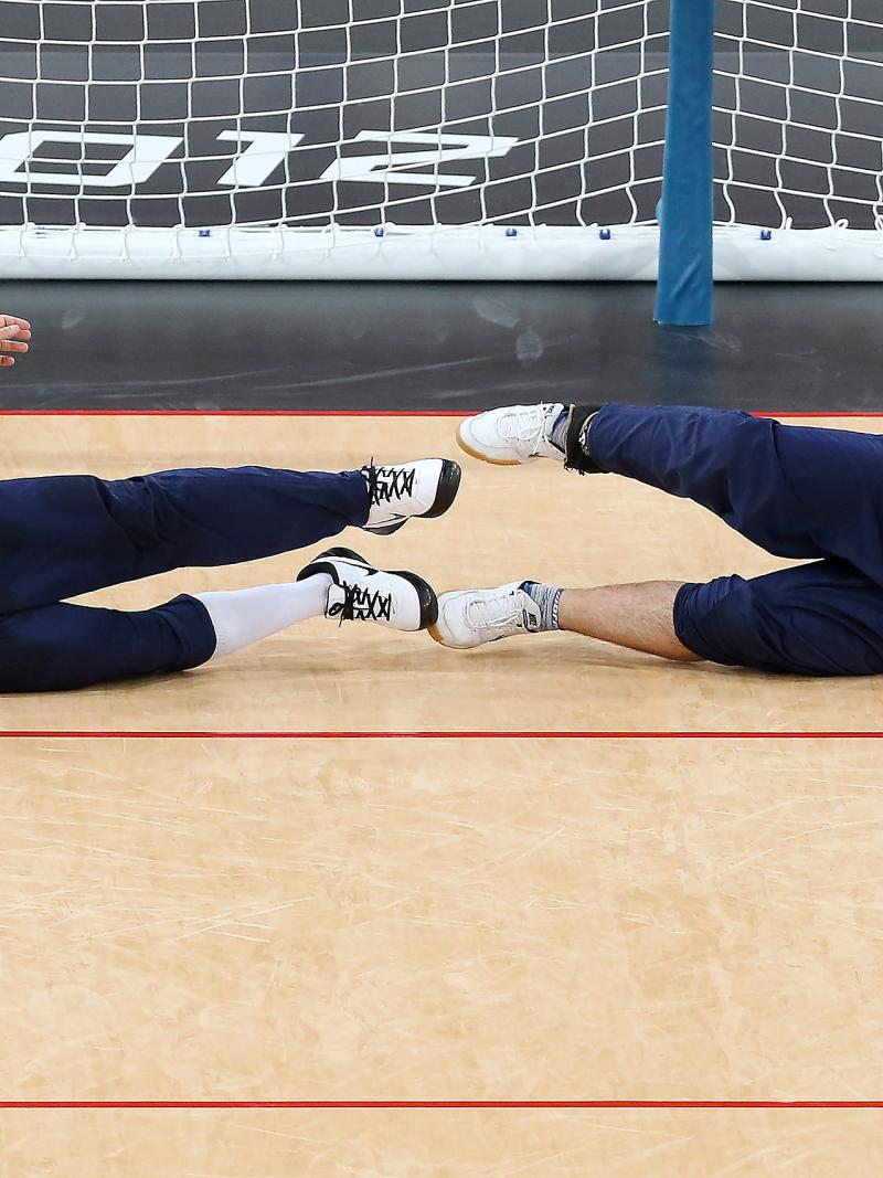 Jose Roberto Ferreira de Oliveira (L) and Filippe Santos Silvestre of Brazil dive in front of the goal during the Men's Group A Goalball match between Finland and Brazil on day 1 of the London 2012 Paralympic Games