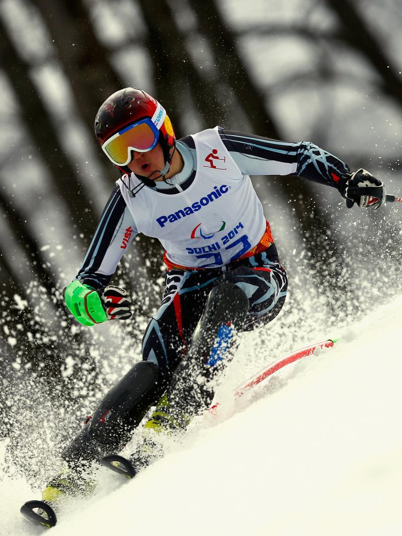 Alexey Bugaev passes a slalom pole in a race in a tilted position