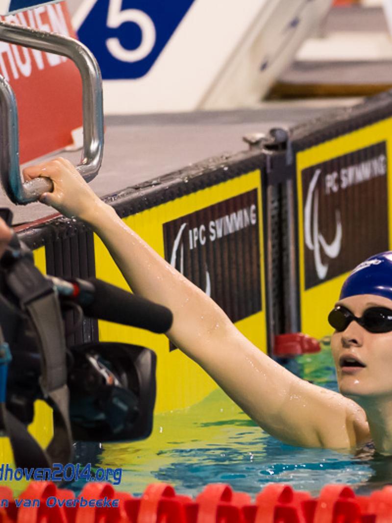 A British swimmer is filmed on completed a race a the 2014 IPC Swimming European Championships