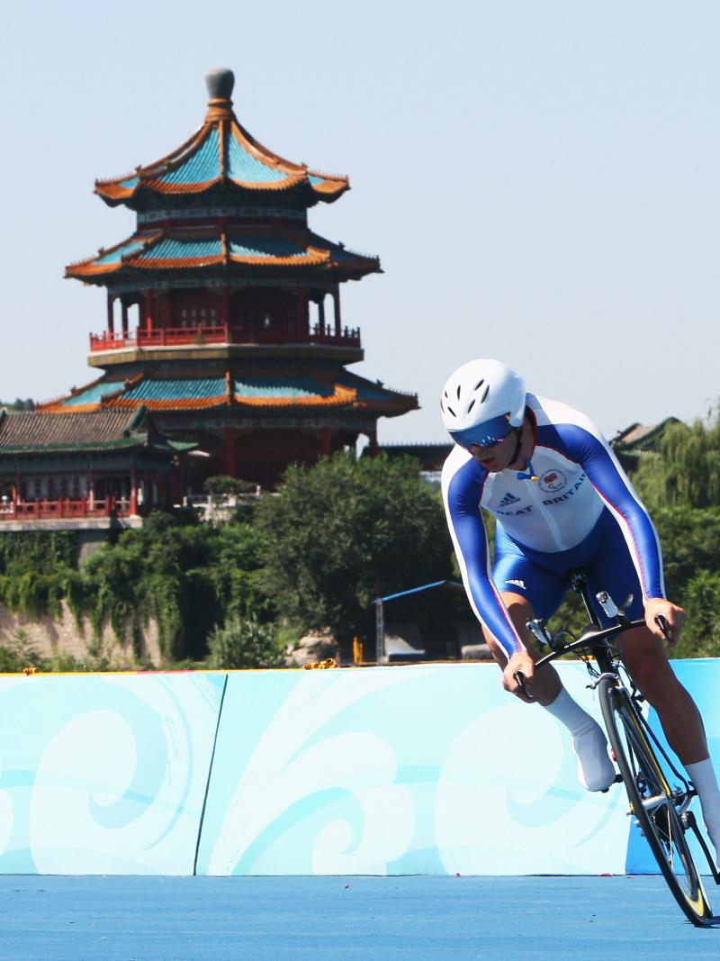 Cyclist in front of the forbidden city during the Beijing 2008 Paralympic Games.