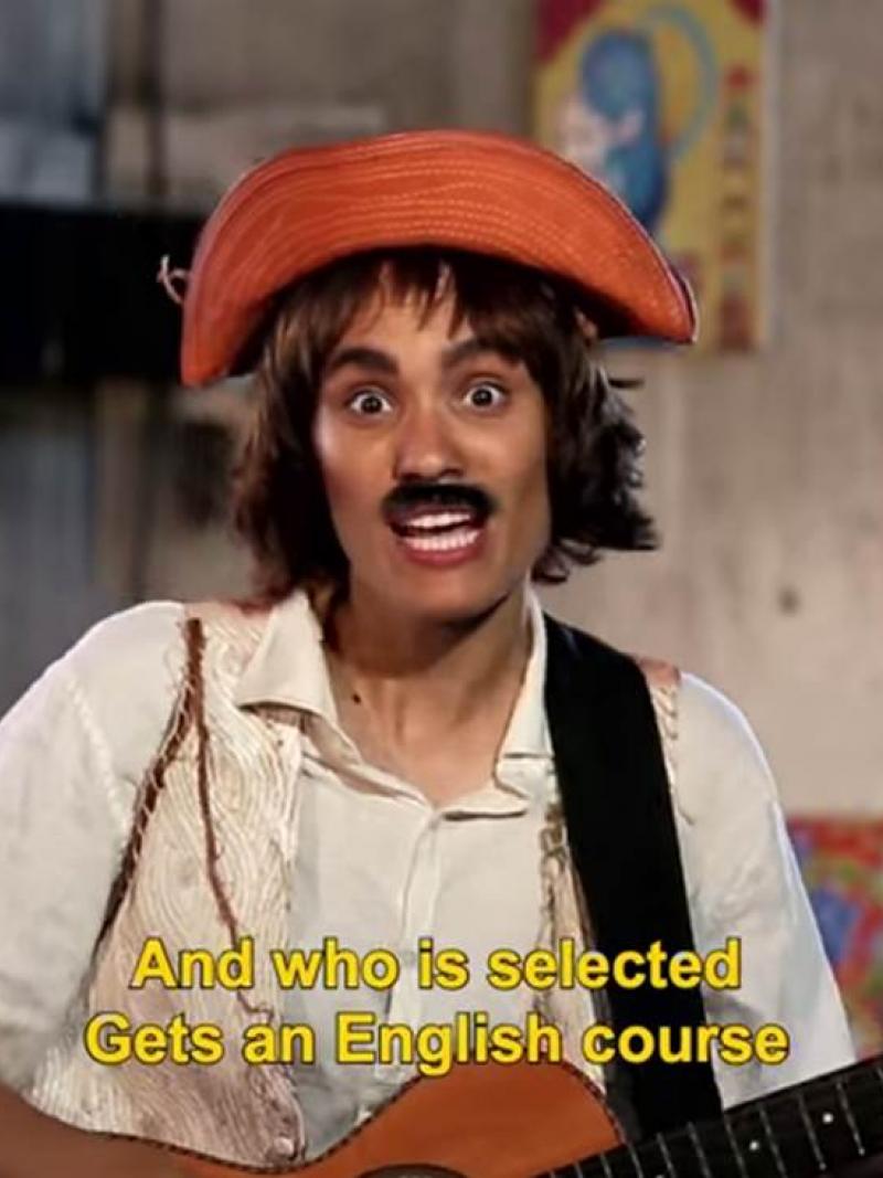 Women dressed like a man with a guitar and a moustache