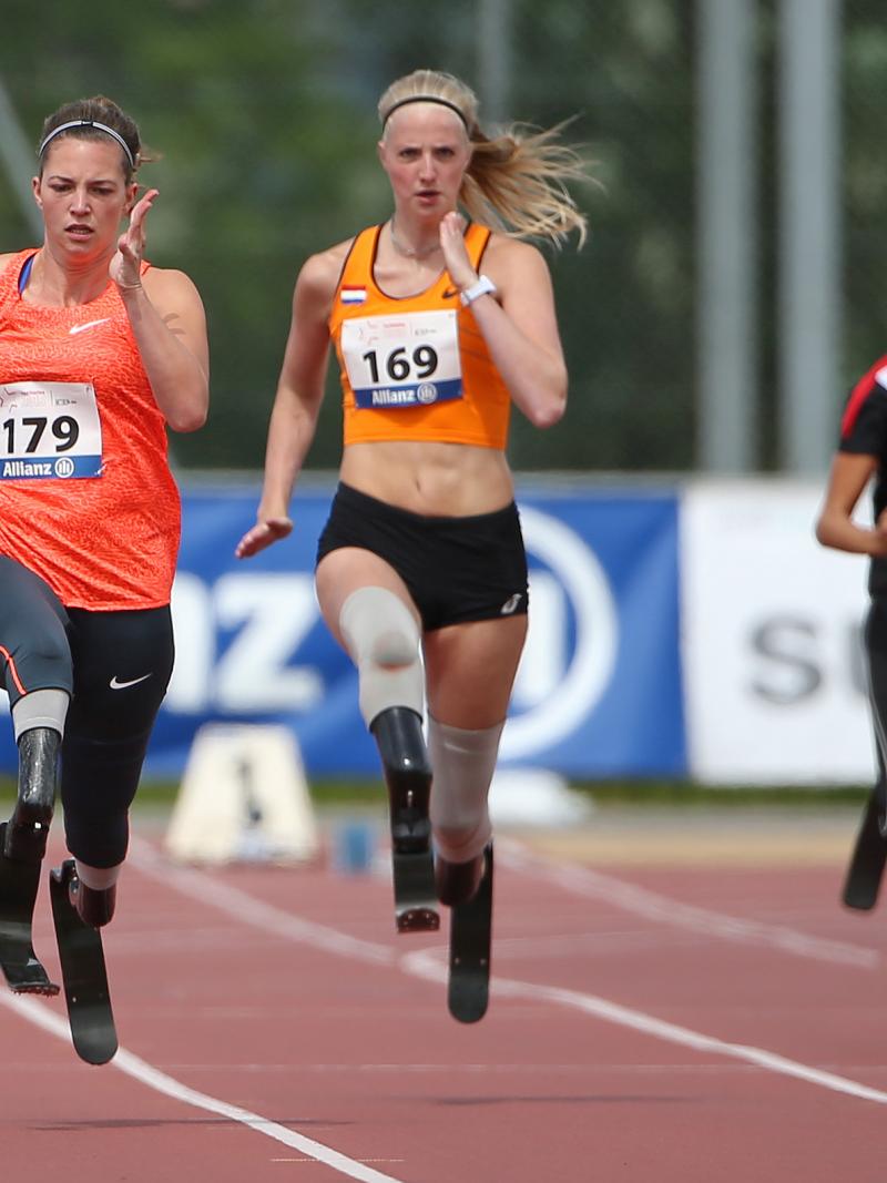 A sprinter overtakes another runner on the 100m straight.