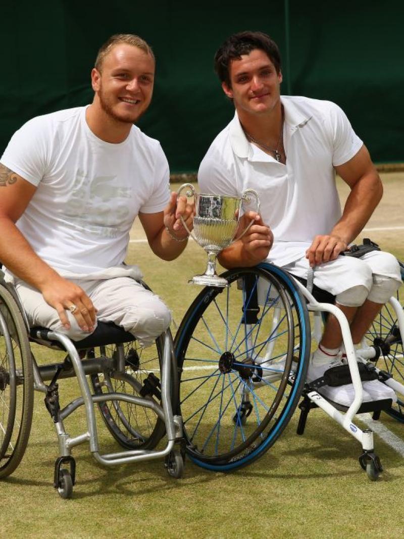 Nicolas Peifer of France and Gustavo Fernandez of Argentina pose with the winners trophy