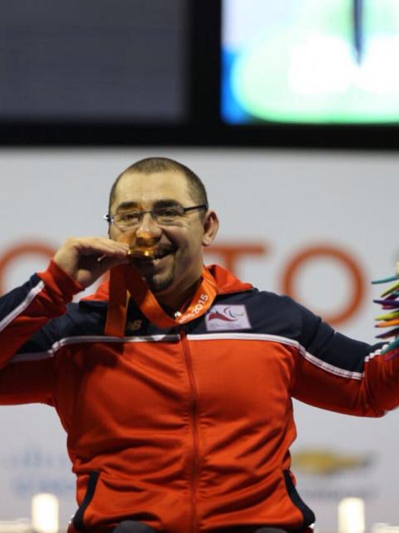 Chile's Juan Garrido Acevedo celebrates winning Toronto 2015 powerlifting gold.