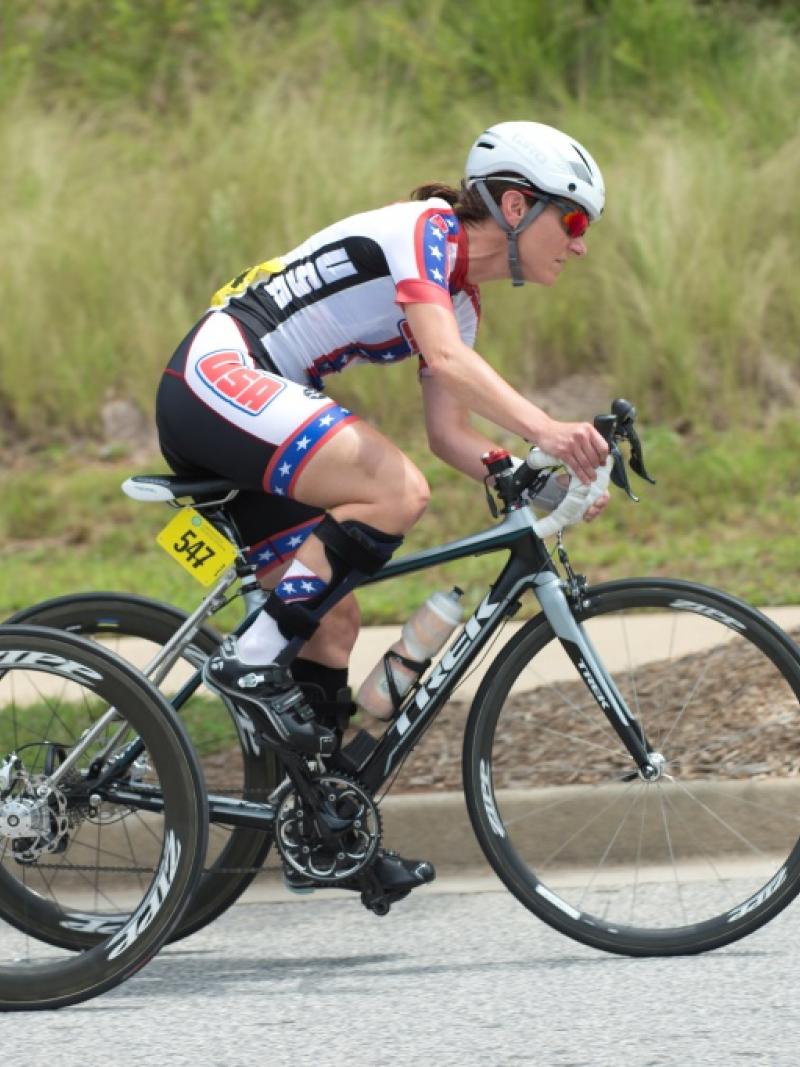 Woman on bike competing