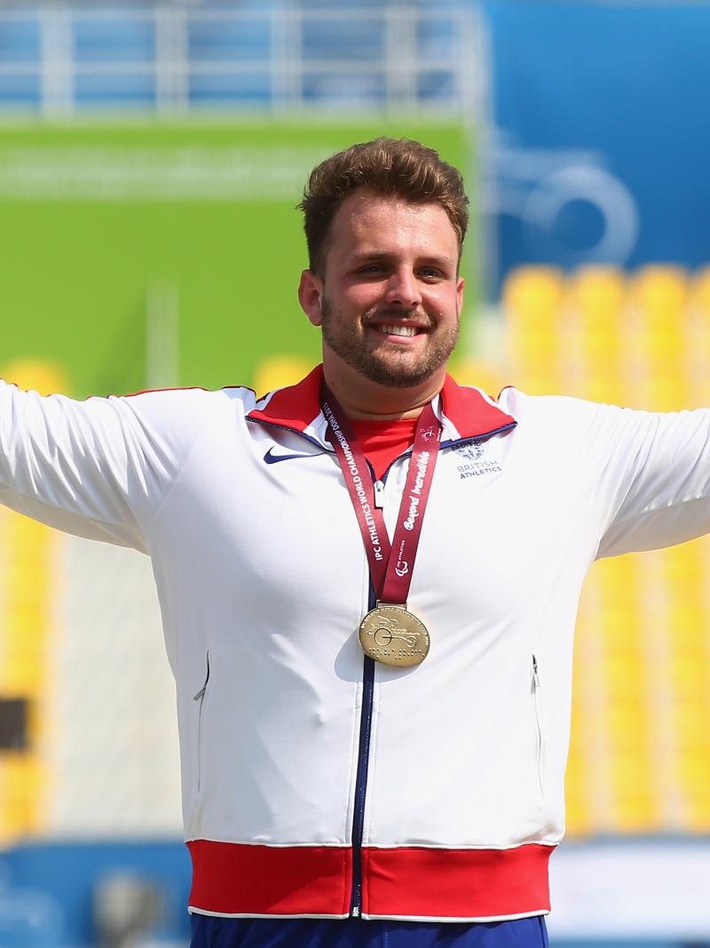 Great Britain's Aled Davies poses with his gold medal at the medal ceremony for the men's shot put F42 final at the 2015 IPC Athletics World Championships in Doha, Qatar.