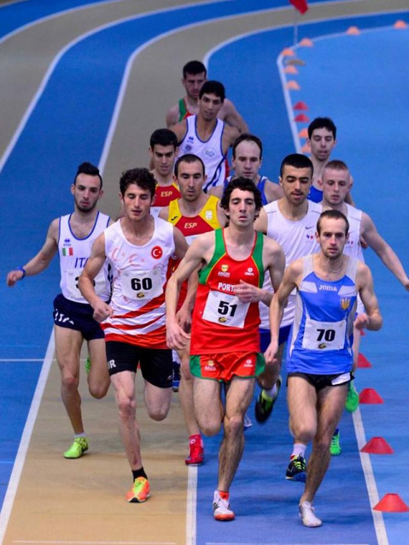 Group of men running on an indoor