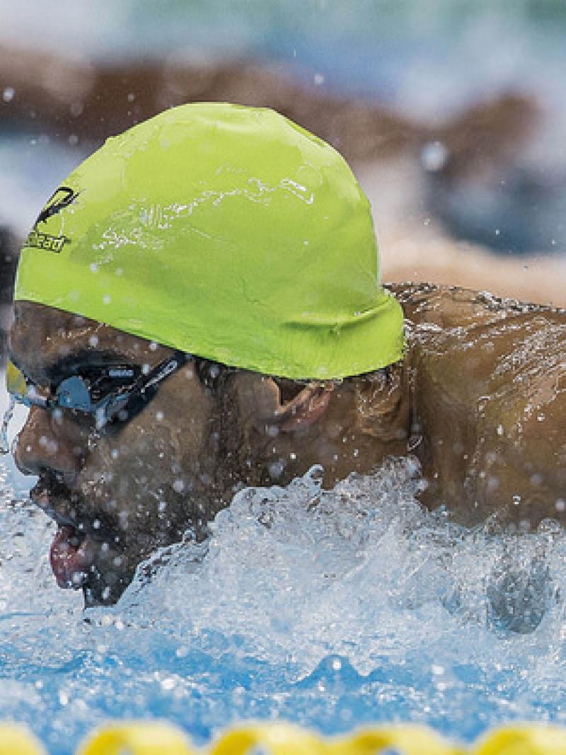 A para-swimmer competes hard