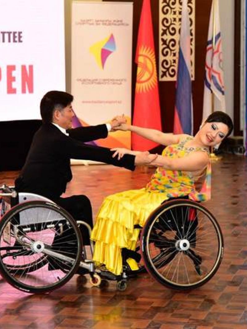 Man and woman in wheelchairs dancing