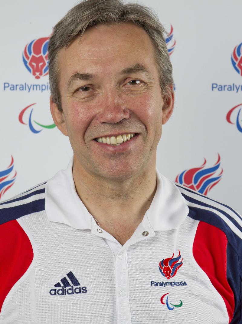 Nick Webborn wears the ParalympicsGB uniform whilst he smiles to the camera.