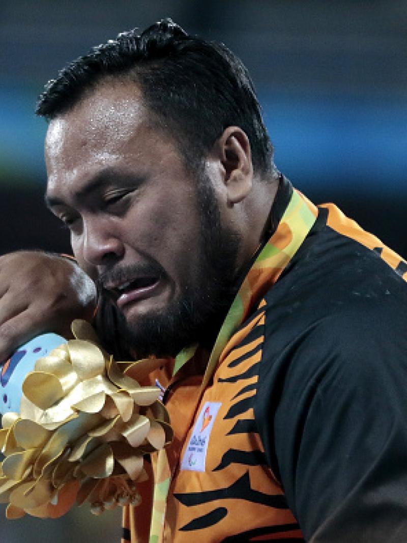 Gold medalist Muhammad Ziyad Zolkefli of Malaysia celebrate on the podium