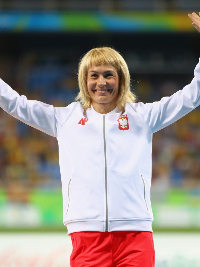 Bronze medalist Barbara Niewiedzial of Poland celebrates on the podium at the medal ceremony for the women's 400m T20 Final at the Rio 2016 Paralympic Games.
