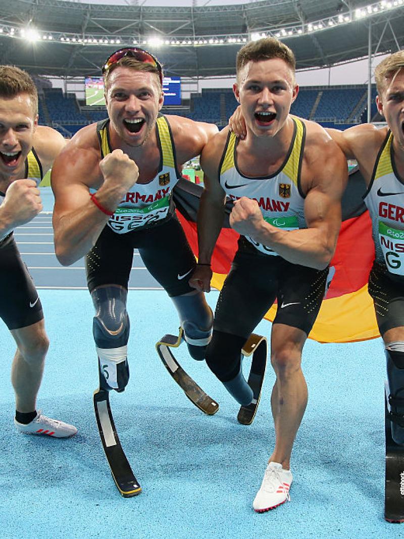 Markus Rehm, David Behre, Felix Streng and Johannes Floors of Germany celebrate after winning the gold medal in the Men's 4x100m - T42-47 final at the Rio 2016 Paralympic Games.