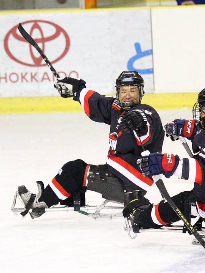 Two ice sledge hockey players on the ice