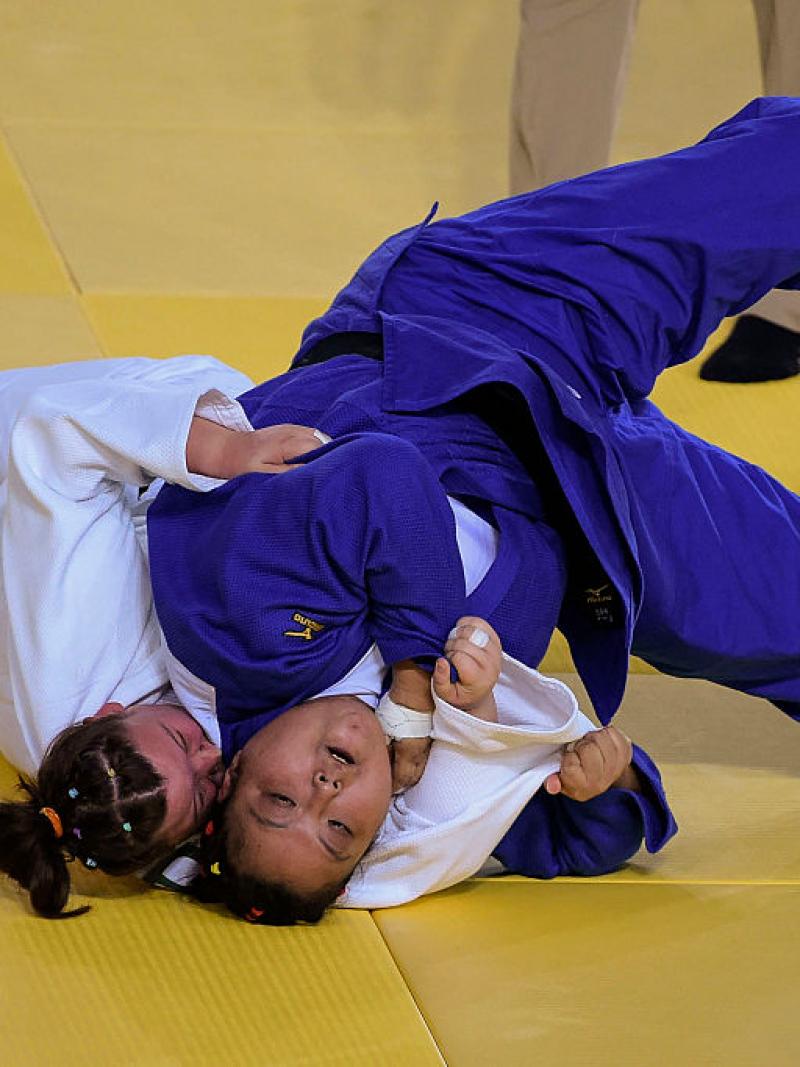 Yanping Yuan (blue) of China with Alimova Khayitjon of Uzbekistan during the Women +70 kg Judo Gold Medal match on Day 3 of the Rio 2016 Paralympic Games