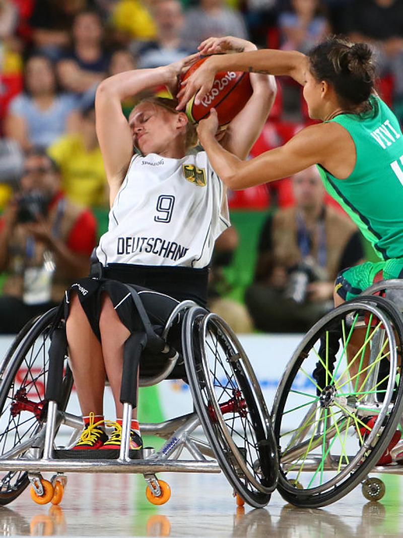 female wheelchair basketball player Laura Fuerst fighting with another player for the ball