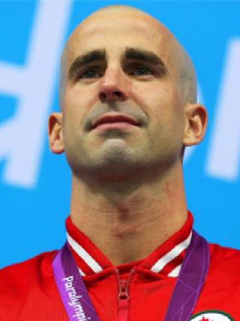 A picture of a man during a medal ceremony