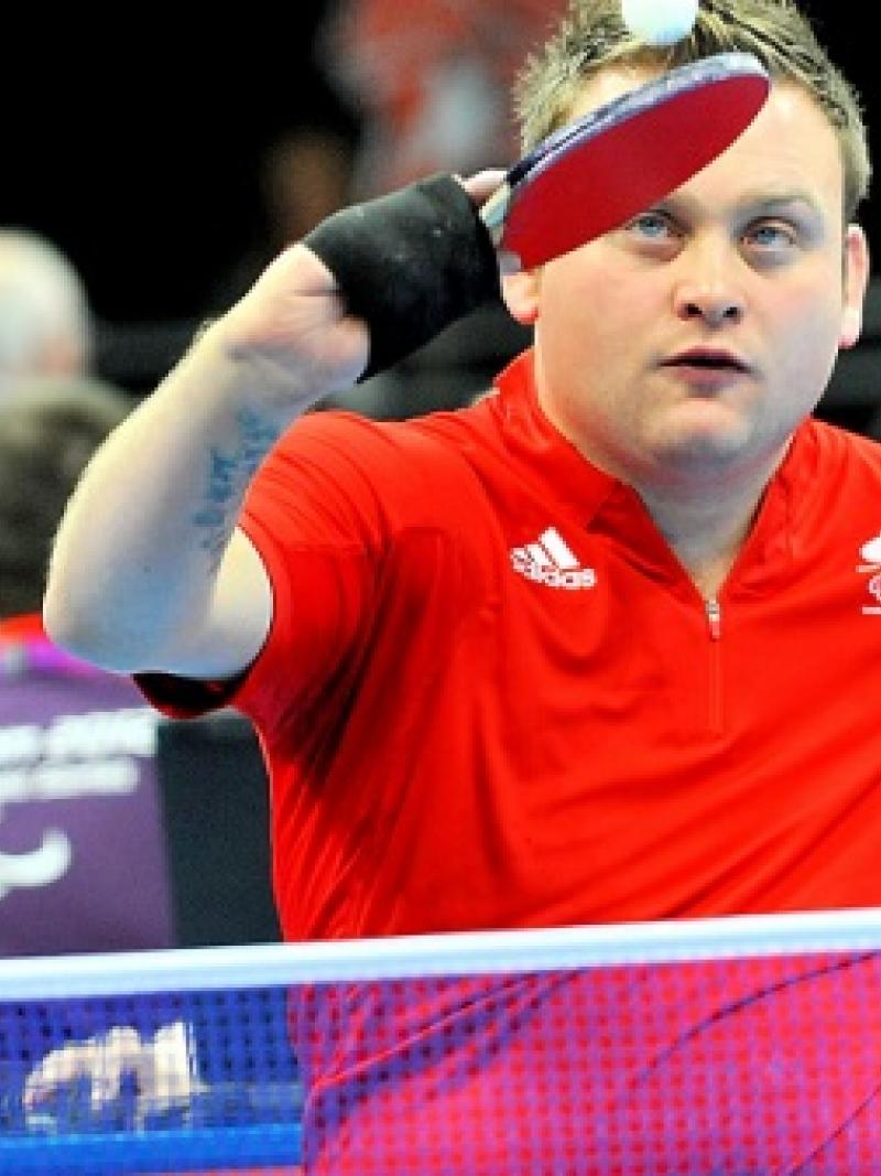 Upper body of man playing table tennis