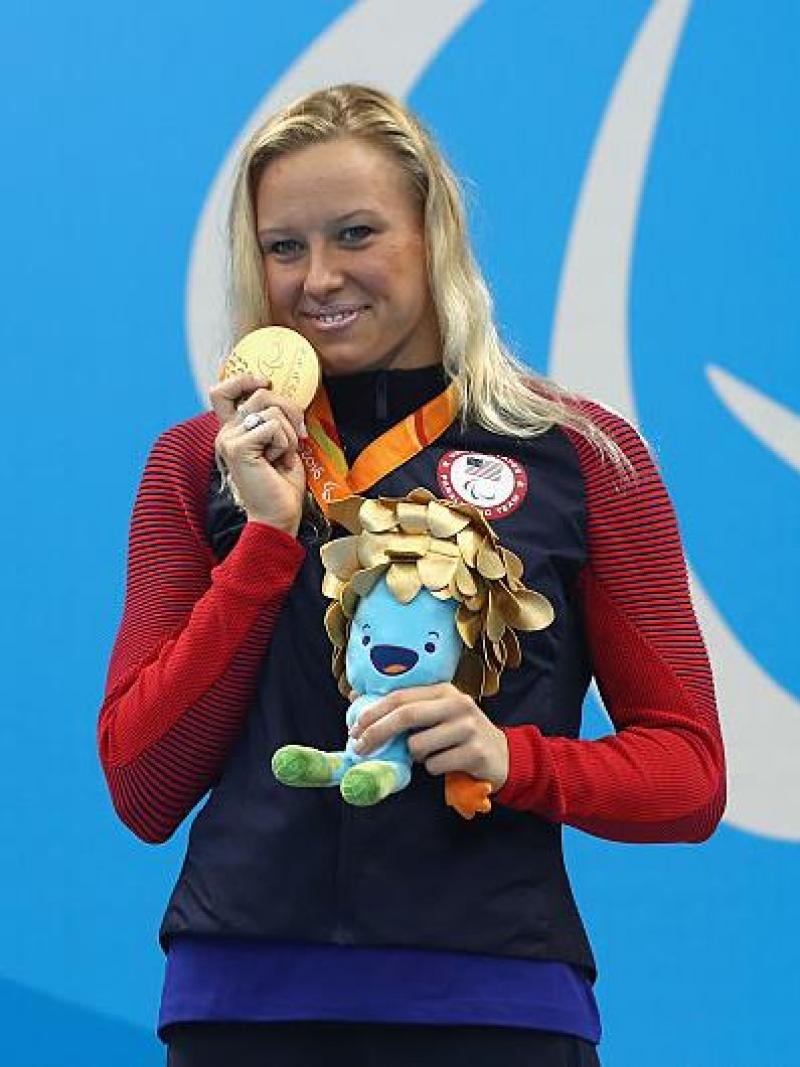 Gold medalist Jessica Long of the United States celebrates on the podium at the medal ceremony for Women's 200m Individual Medley - SM8 at the Rio 2016 Paralympic Games.