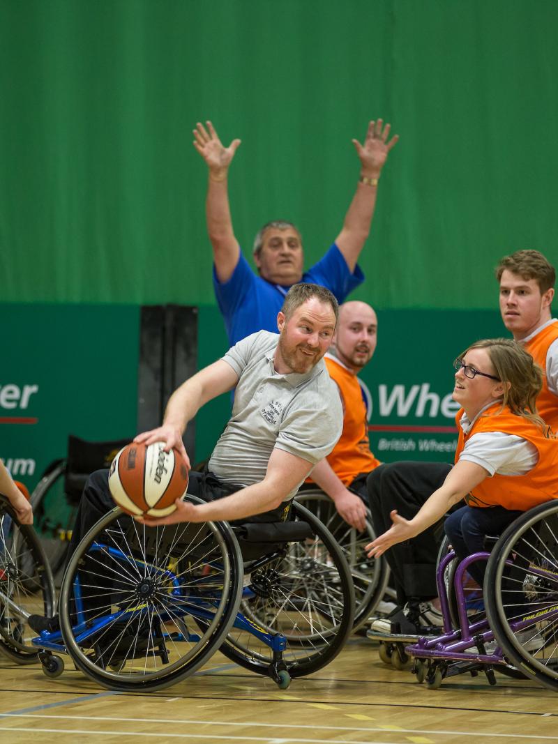 People playing wheelchair basketball