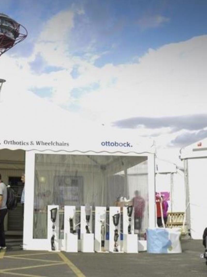 a technicians tent with athletes queuing outside