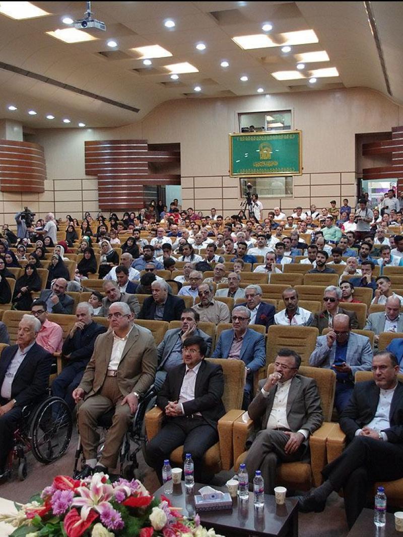 a group of Para athletes seated in an auditorium